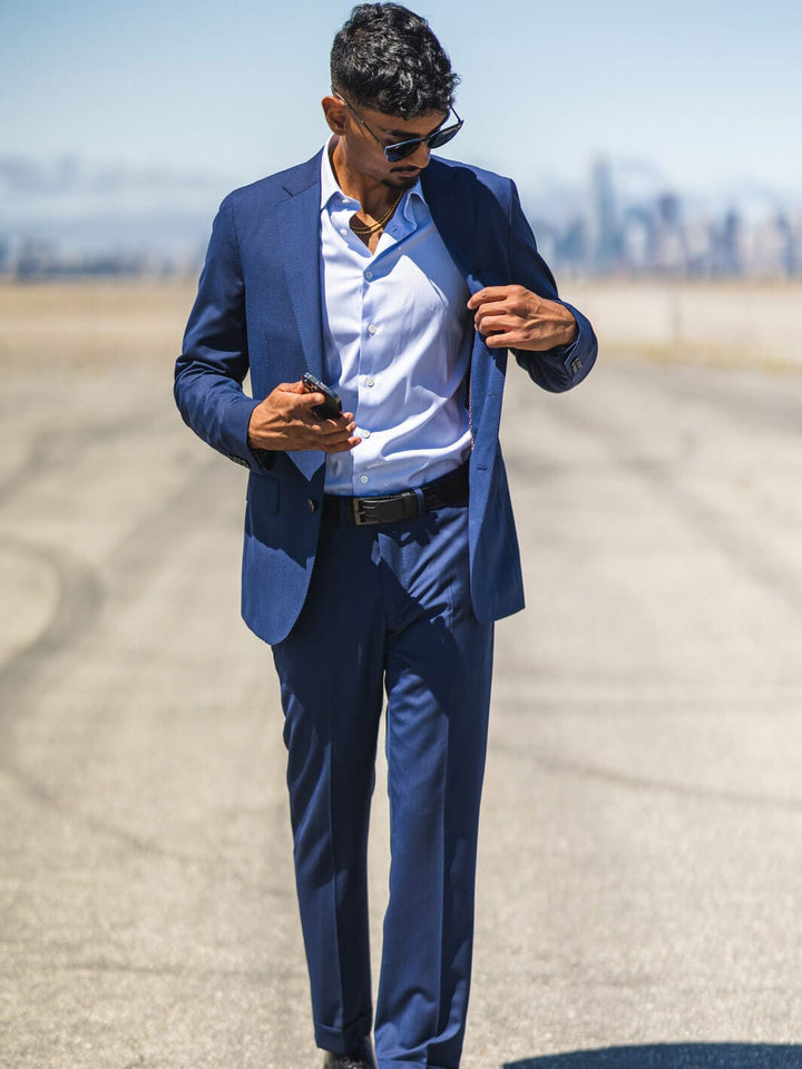 Man posing in Anatoly & Sons Blue Drago Skyfall Suit